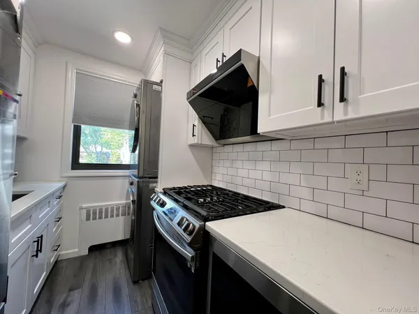 a kitchen with a stove and a microwave