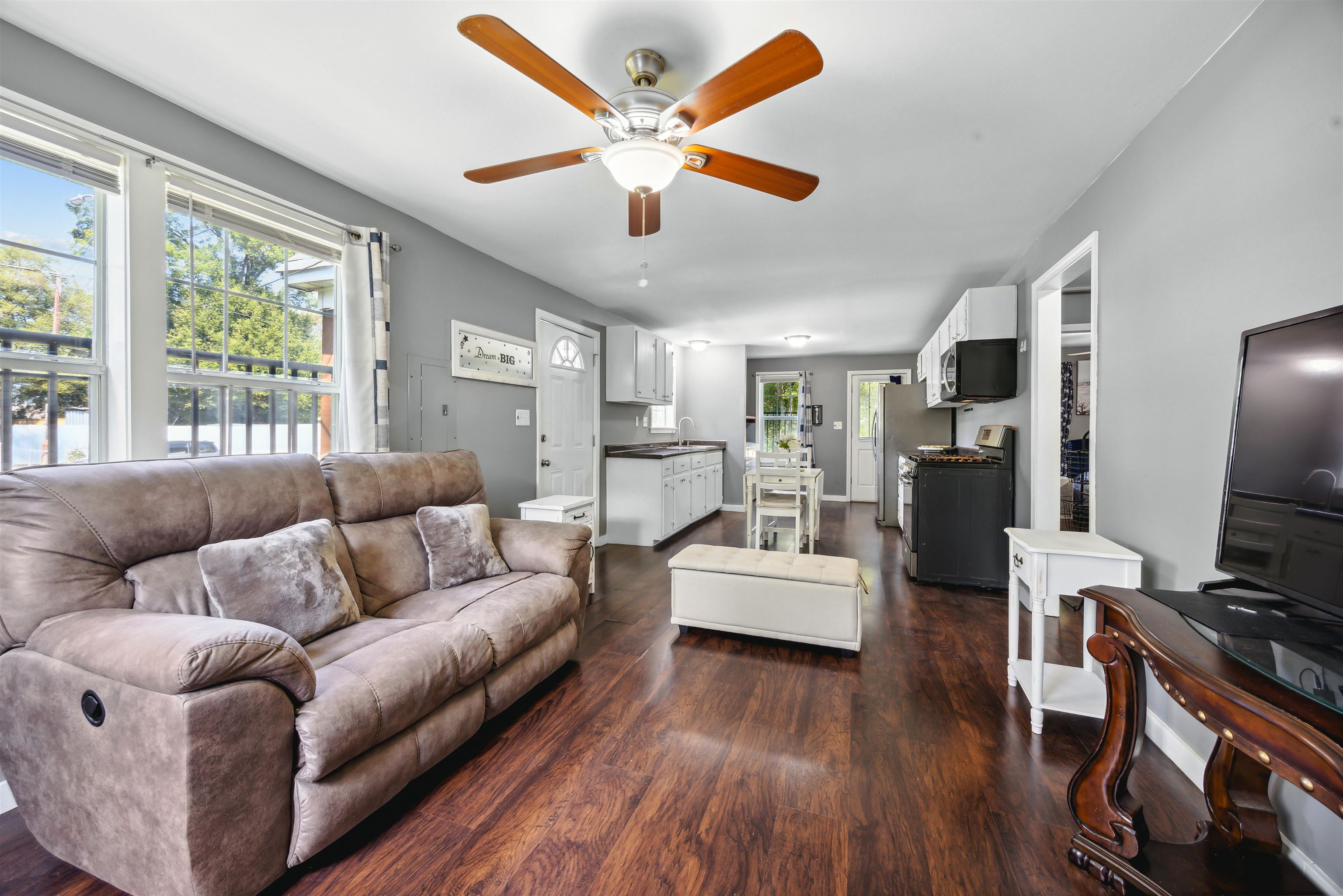 3014 Benjestown Road Memphis, TN 38127 - Photo 3 of 15 Living room with dark hardwood / wood-style flooring, plenty of natural light, and ceiling fan