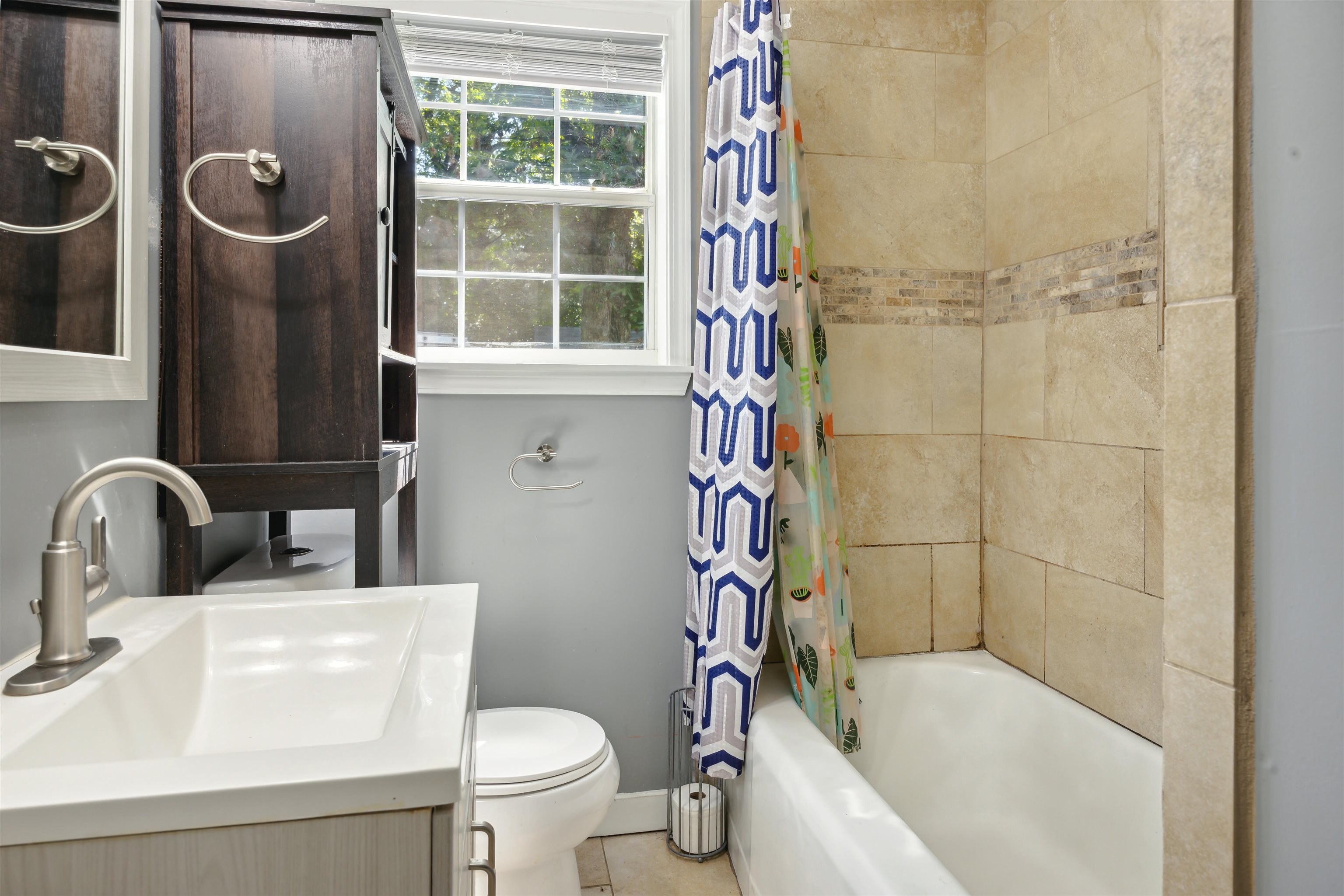 3014 Benjestown Road Memphis, TN 38127 - Photo 4 of 15 Full bathroom with toilet, vanity, shower / bath combo, and tile patterned floors