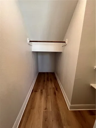 a view of wooden floor in an empty room