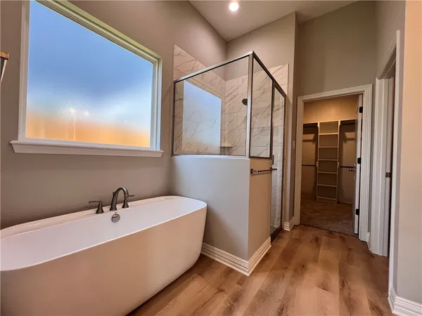 a bathroom with a bathtub and a sink
