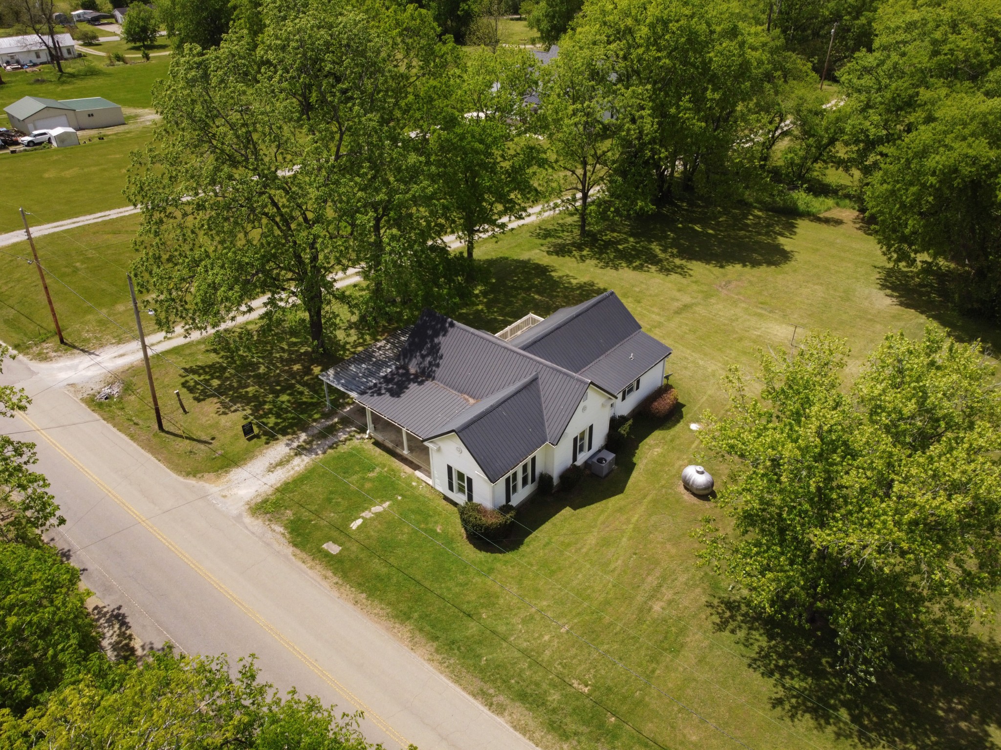 2727 Fly Road Santa Fe, TN 38482 - Photo 18 of 21 an aerial view of a house with swimming pool and large trees
