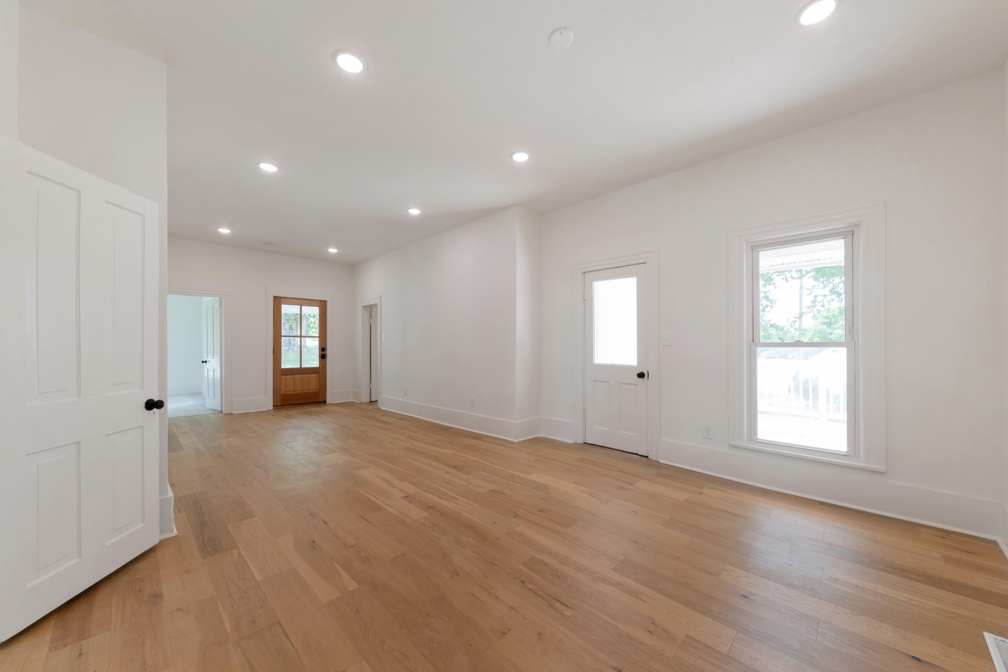 2727 Fly Road Santa Fe, TN 38482 - Photo 3 of 21 an empty room with wooden floor and windows