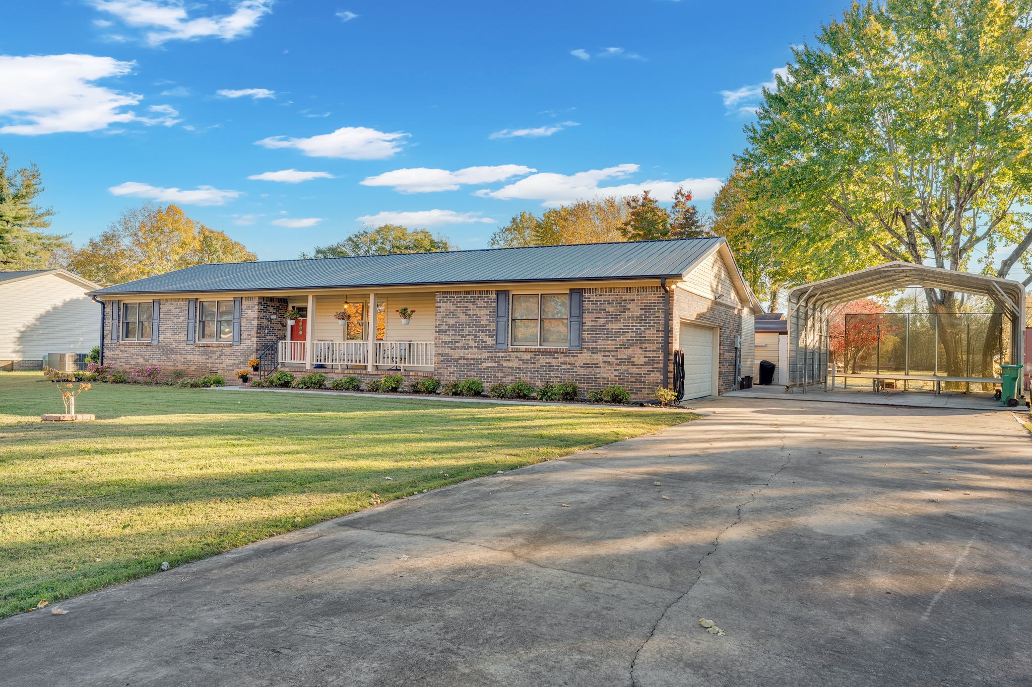 103 Lisa Circle Winchester, TN 37398 - Photo 46 of 61 a front view of a house with a big yard and large trees