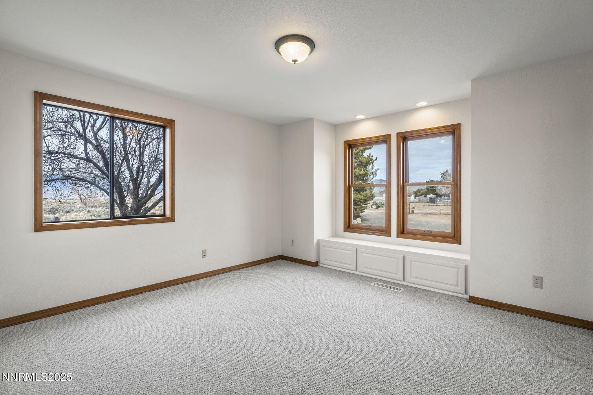 1653 Dees Lane Minden, NV 89423 - Photo 18 of 36 an empty room with windows and closet