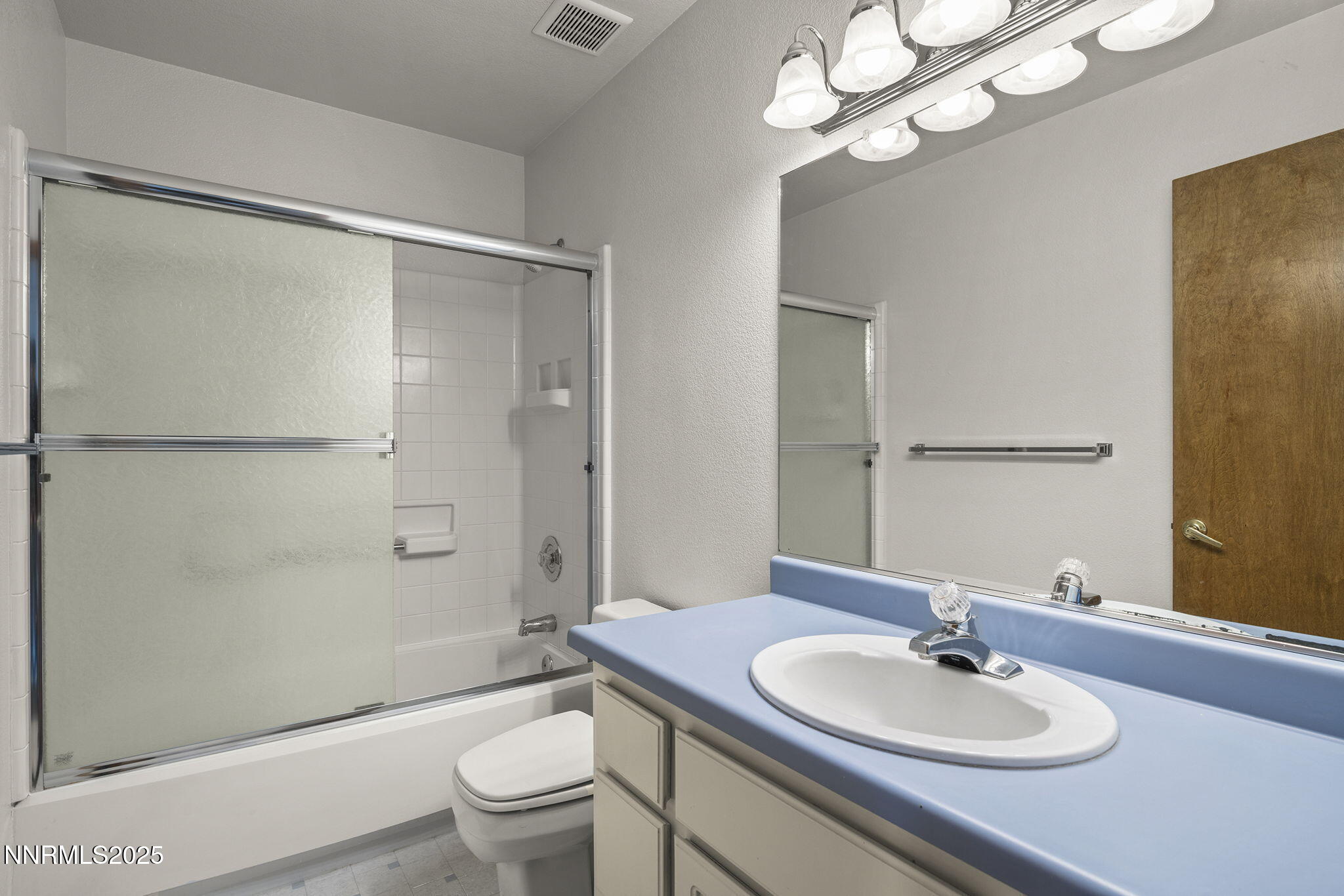 1653 Dees Lane Minden, NV 89423 - Photo 21 of 36 a bathroom with a sink a toilet and shower