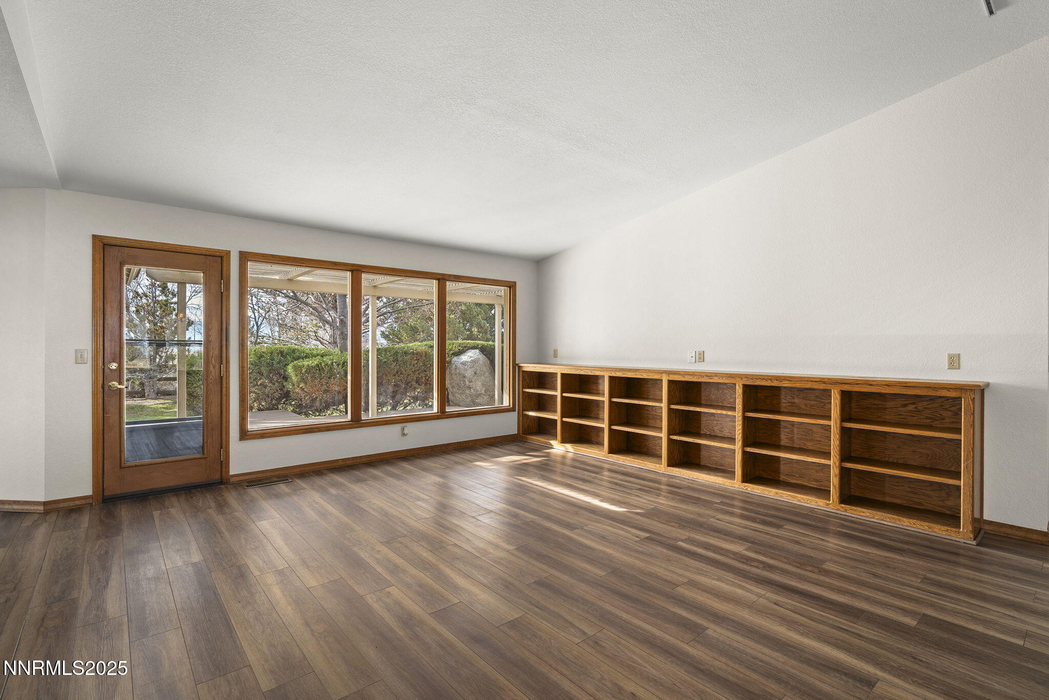 1653 Dees Lane Minden, NV 89423 - Photo 7 of 36 wooden floor in an empty room with a window