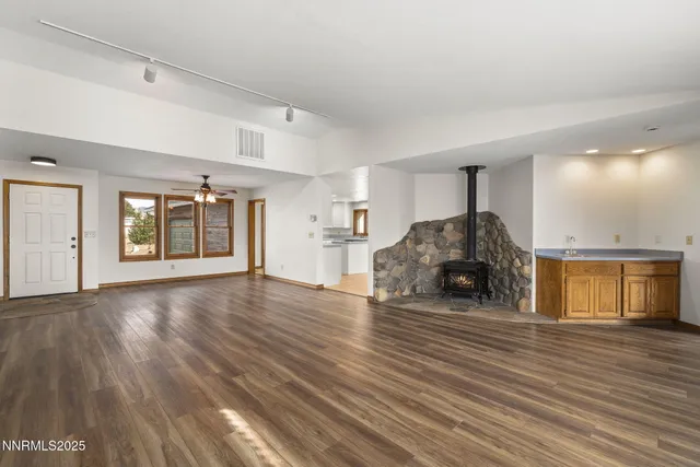 a view of a livingroom with furniture and wooden floor