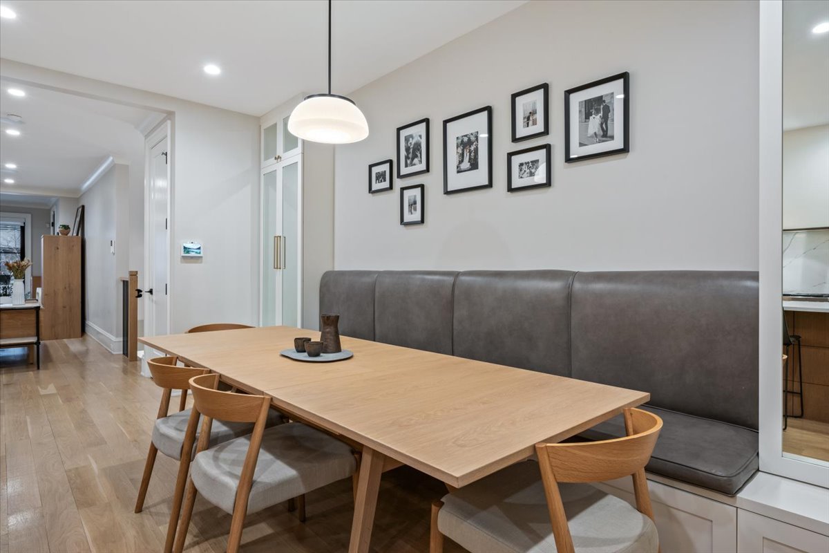 2212 North Halsted Street, Unit 1 Chicago, IL 60614 - Photo 12 of 38 a view of a dining room with furniture and wooden floor