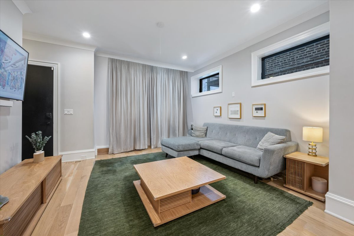 2212 North Halsted Street, Unit 1 Chicago, IL 60614 - Photo 15 of 38 a living room with furniture and a couch