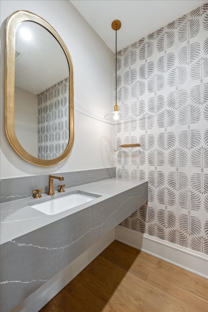 2212 North Halsted Street, Unit 1 Chicago, IL 60614 - Photo 17 of 38 a bathroom with a sink and a mirror