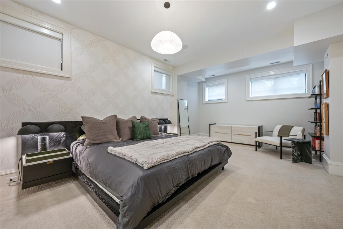 2212 North Halsted Street, Unit 1 Chicago, IL 60614 - Photo 18 of 38 a bedroom with bed and window