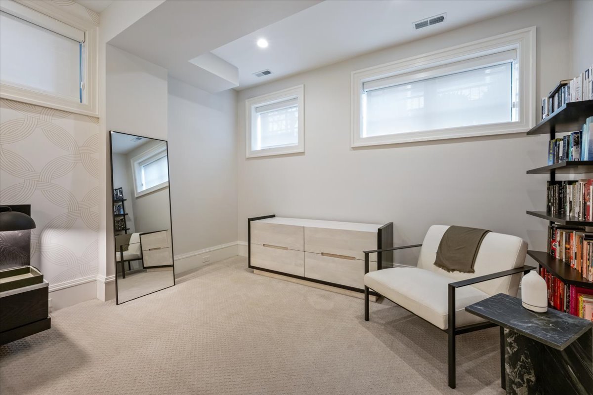 2212 North Halsted Street, Unit 1 Chicago, IL 60614 - Photo 19 of 38 a bedroom with furniture and a window