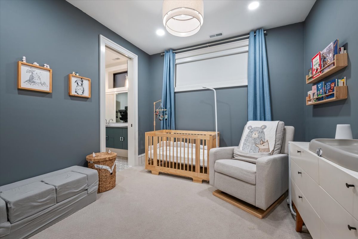 2212 North Halsted Street, Unit 1 Chicago, IL 60614 - Photo 23 of 38 a bedroom with furniture and a window