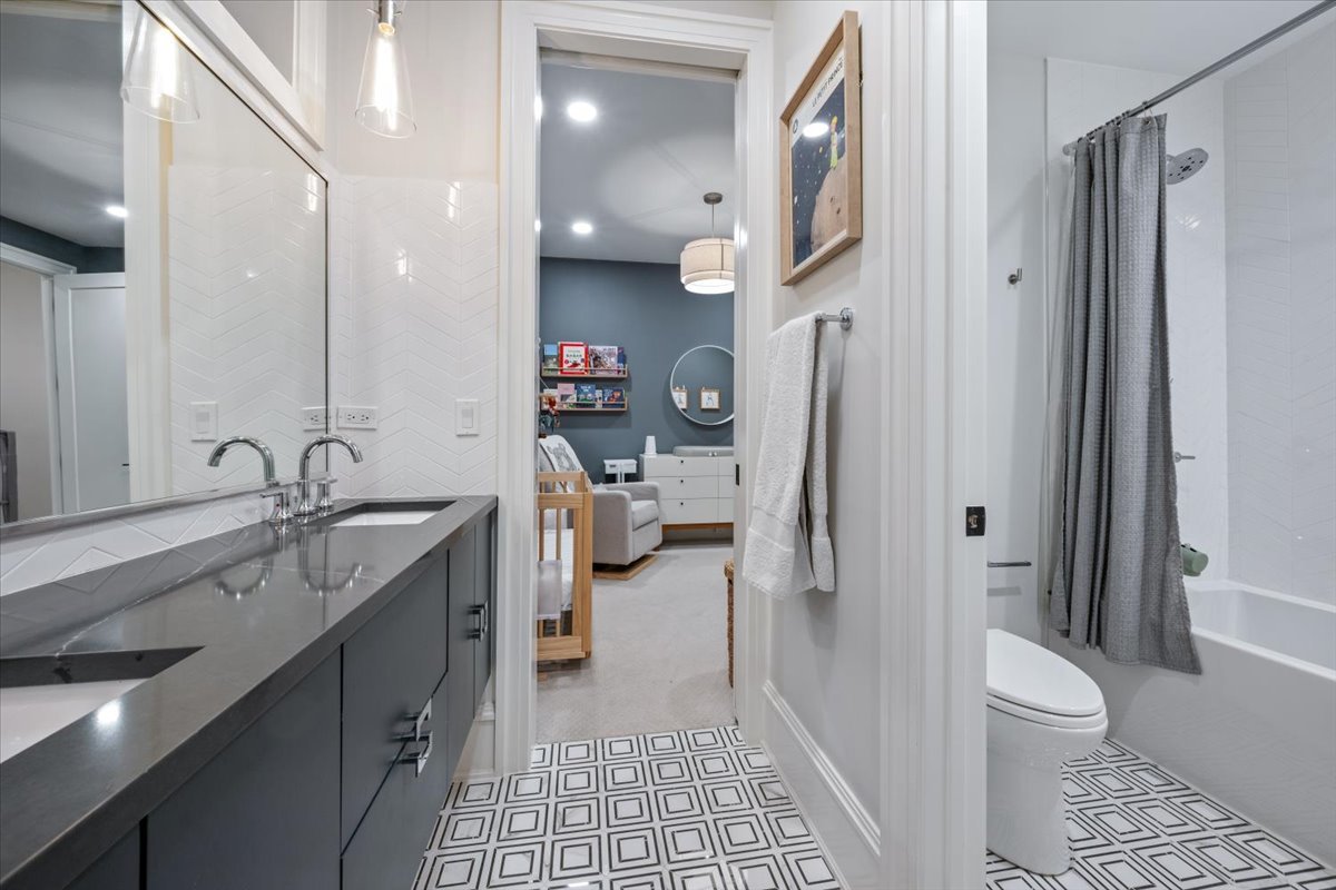 2212 North Halsted Street, Unit 1 Chicago, IL 60614 - Photo 24 of 38 a spacious bathroom with a sink a toilet and a shower