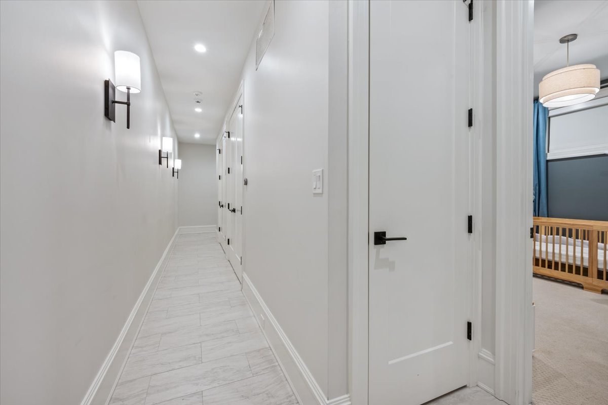 2212 North Halsted Street, Unit 1 Chicago, IL 60614 - Photo 27 of 38 a view of a hallway with wooden floor and staircase
