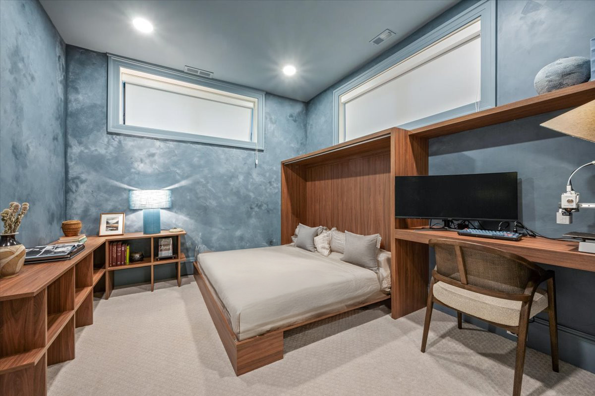 2212 North Halsted Street, Unit 1 Chicago, IL 60614 - Photo 29 of 38 a bedroom with a bed and a flat screen tv