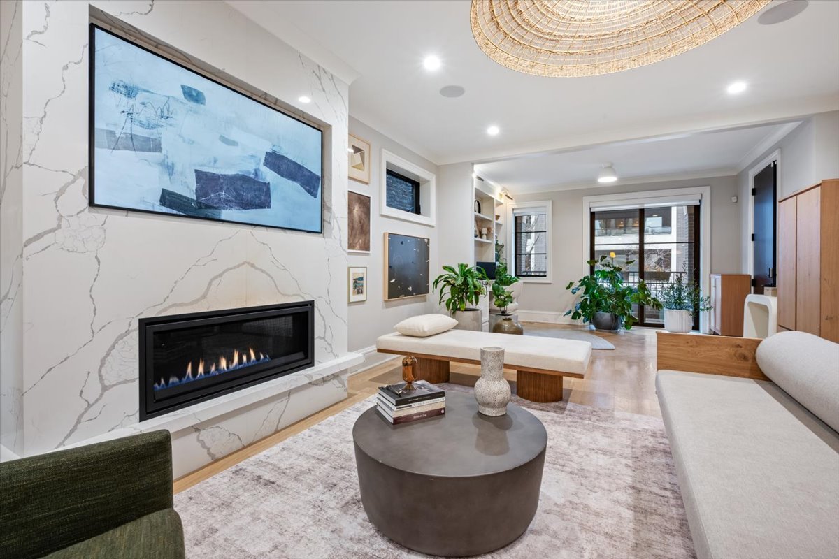 2212 North Halsted Street, Unit 1 Chicago, IL 60614 - Photo 5 of 38 a living room with furniture and a fireplace