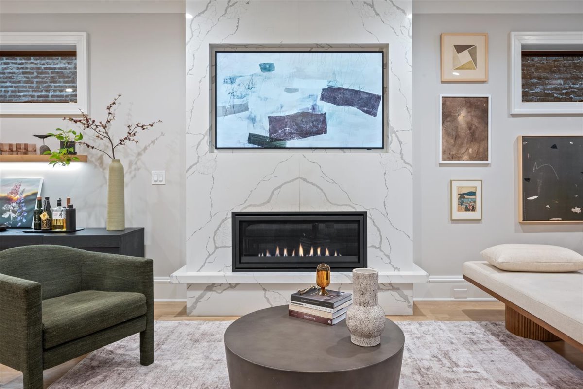 2212 North Halsted Street, Unit 1 Chicago, IL 60614 - Photo 6 of 38 a living room with furniture and a fireplace