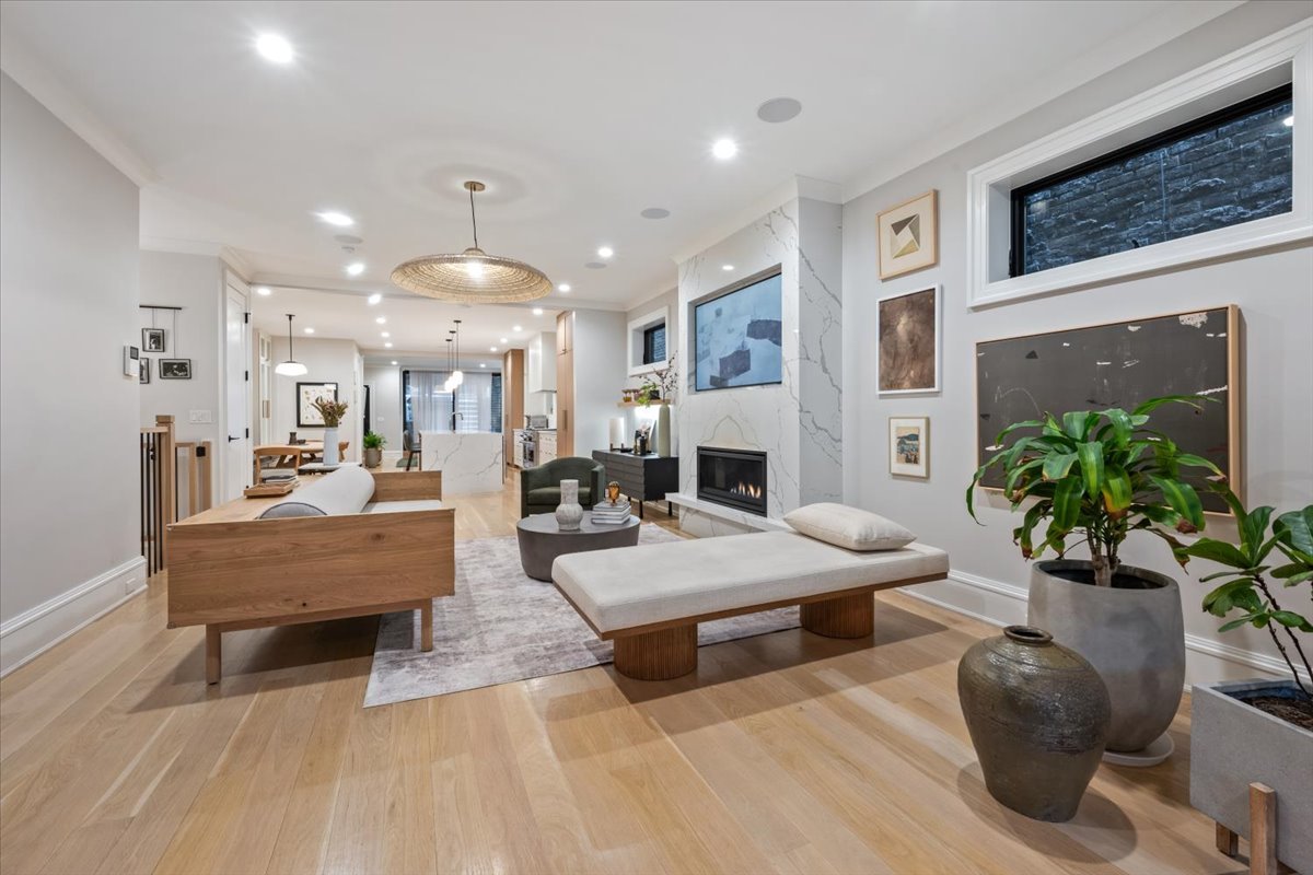 2212 North Halsted Street, Unit 1 Chicago, IL 60614 - Photo 8 of 38 a living room with furniture a fireplace and a potted plant