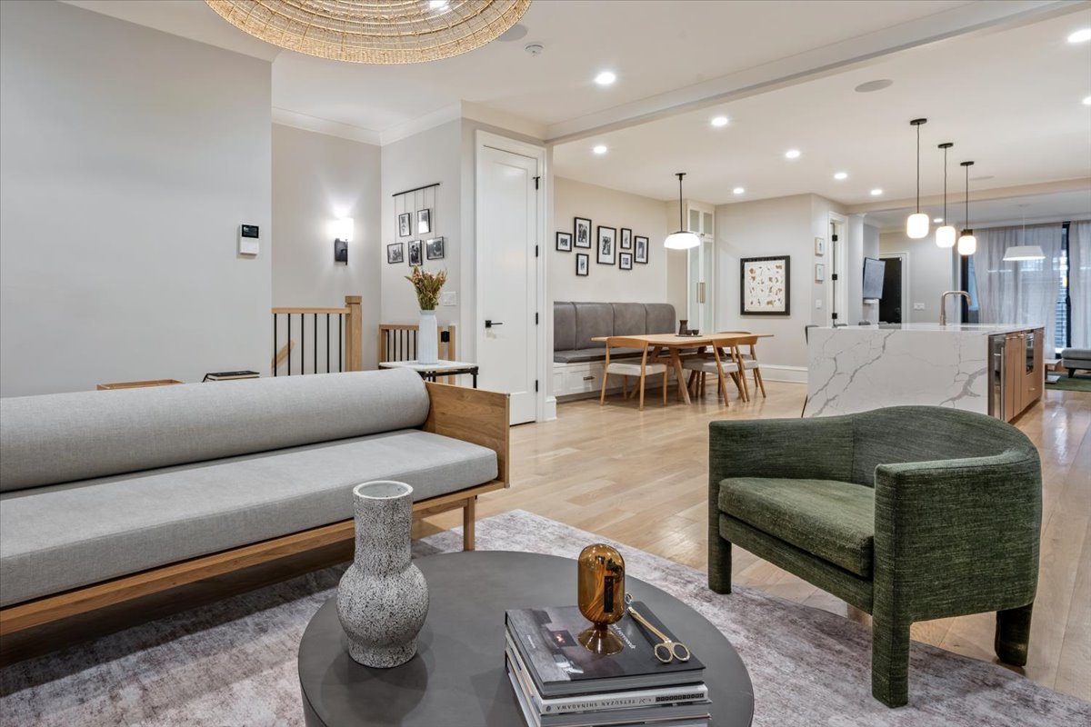 2212 North Halsted Street, Unit 1 Chicago, IL 60614 - Photo 9 of 38 a living room with furniture and a chandelier