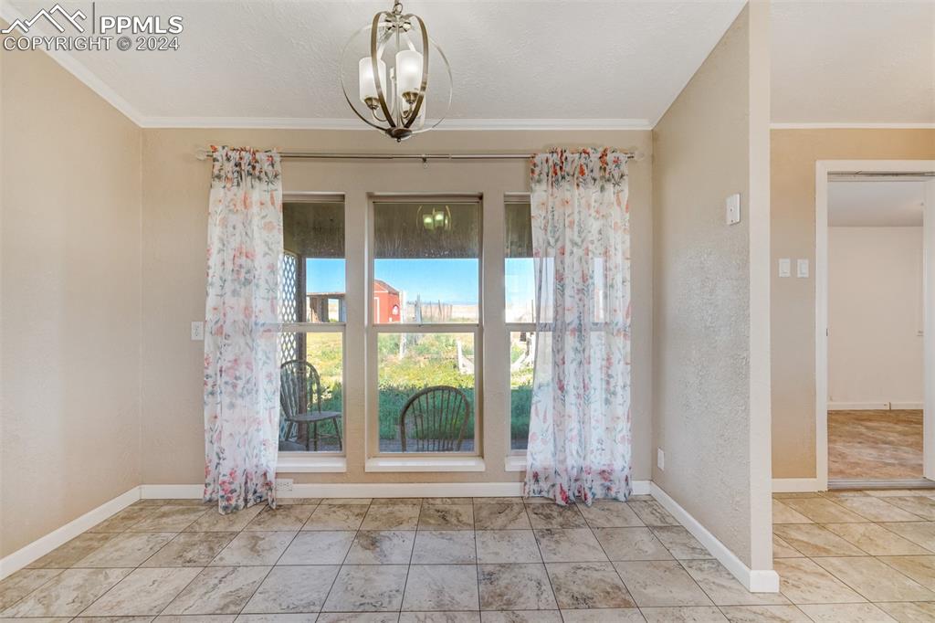 6240 Night Train Lane Yoder, CO 80864 - Photo 22 of 50 a view of an empty room with a window