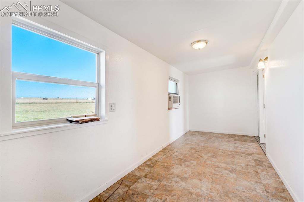 6240 Night Train Lane Yoder, CO 80864 - Photo 24 of 50 an empty room with windows