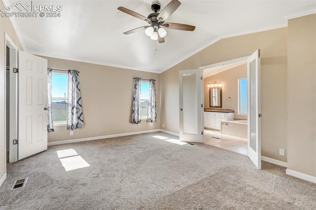 6240 Night Train Lane Yoder, CO 80864 - Photo 25 of 50 a view of a livingroom with wooden floor and a ceiling fan