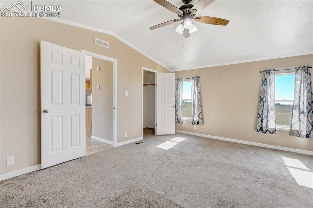 6240 Night Train Lane Yoder, CO 80864 - Photo 26 of 50 an empty room with chandelier fan