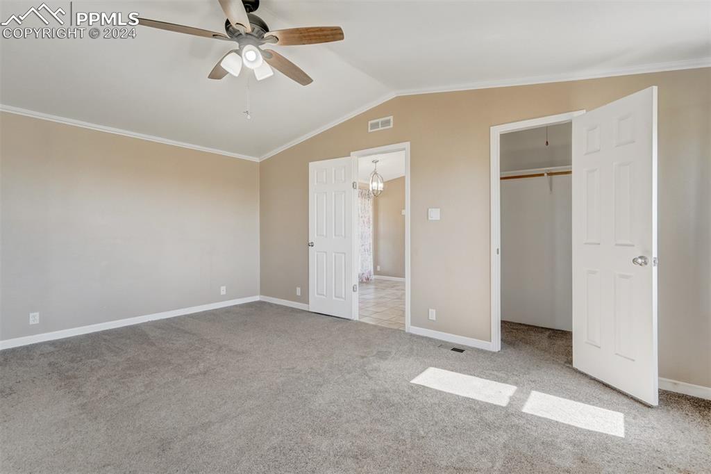 6240 Night Train Lane Yoder, CO 80864 - Photo 27 of 50 an empty room with closet and windows