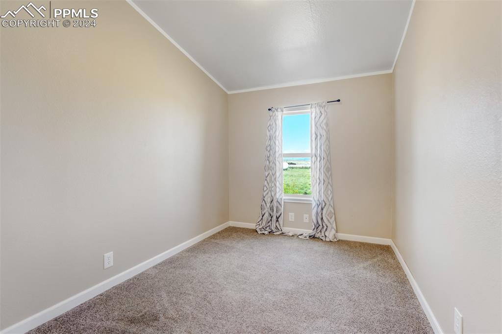 6240 Night Train Lane Yoder, CO 80864 - Photo 32 of 50 an empty room with windows