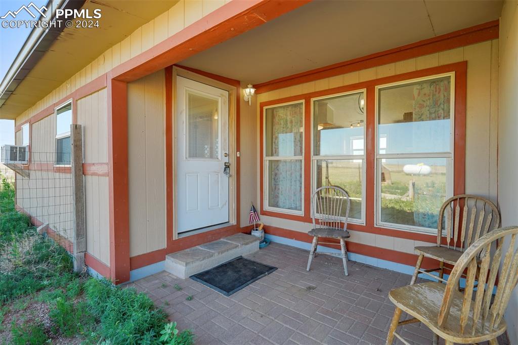 6240 Night Train Lane Yoder, CO 80864 - Photo 39 of 50 a backyard of a house with seating space