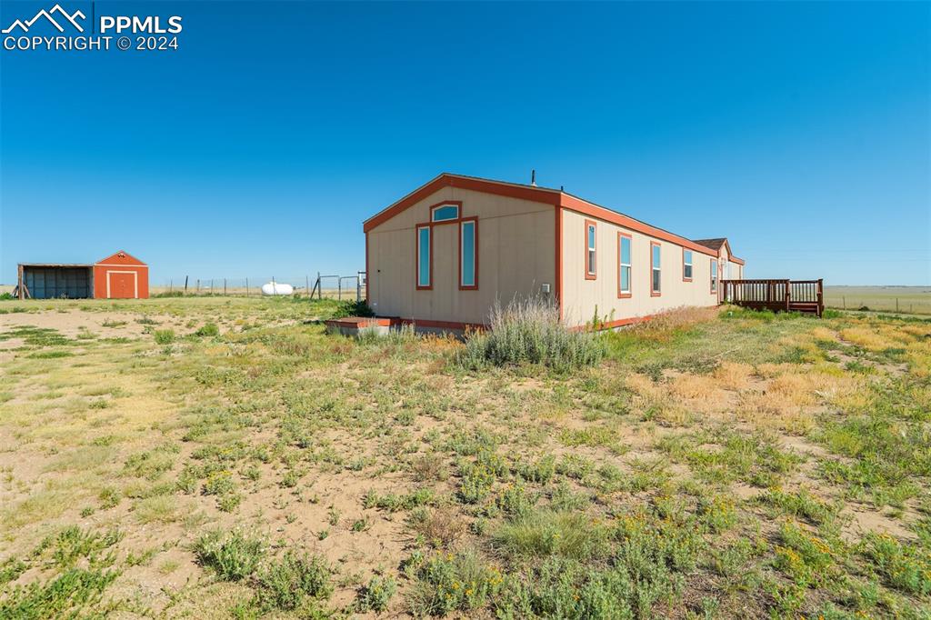 6240 Night Train Lane Yoder, CO 80864 - Photo 4 of 50 a big room with a yard