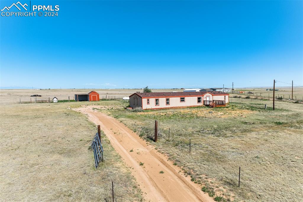 6240 Night Train Lane Yoder, CO 80864 - Photo 7 of 50 a view of a swimming pool with an outdoor seating