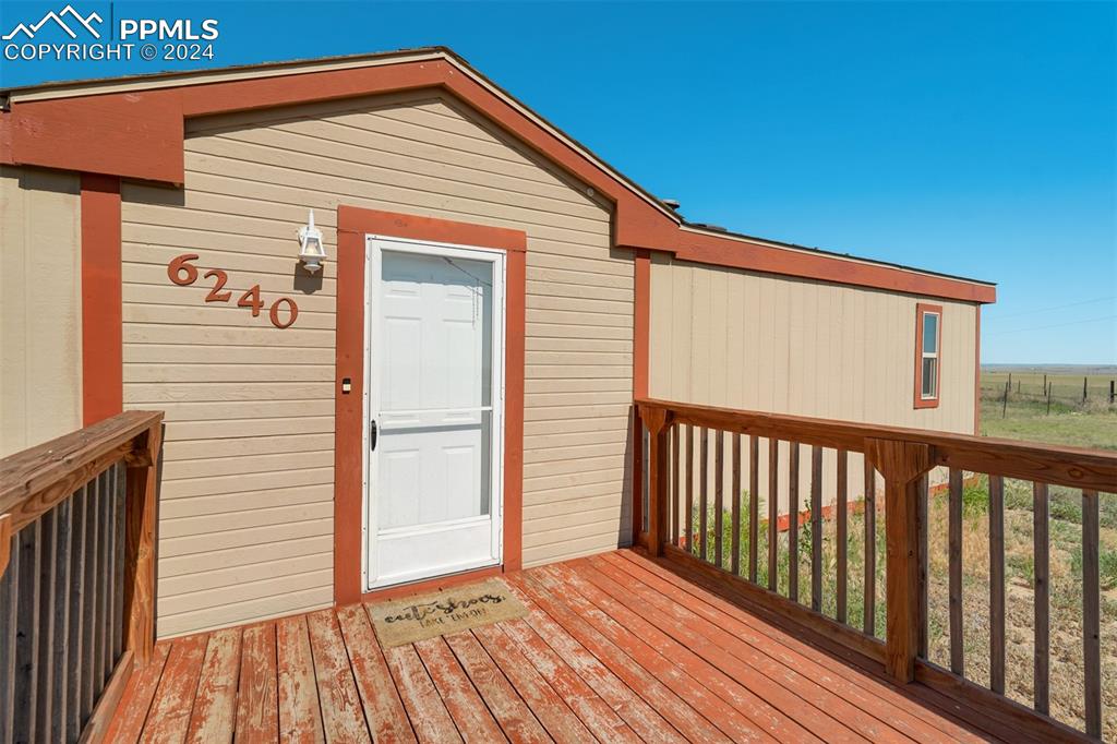6240 Night Train Lane Yoder, CO 80864 - Photo 9 of 50 a view of a wooden house with a door