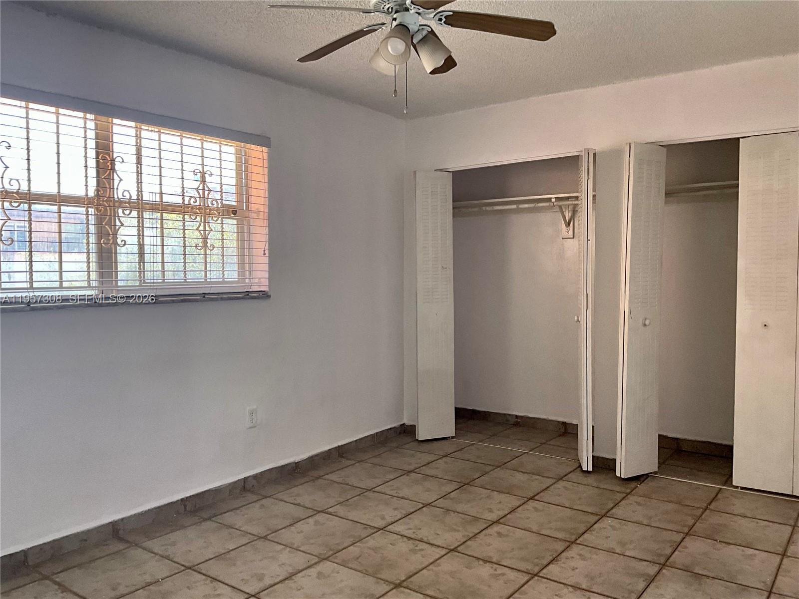 1910 West 56th Street, Unit 3302 Hialeah, FL 33012 - Photo 15 of 19 a view of an empty room with a window