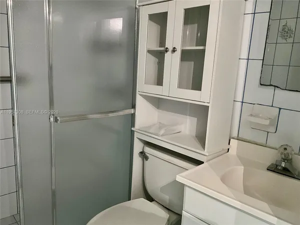 a view of a wooden deck with furniture