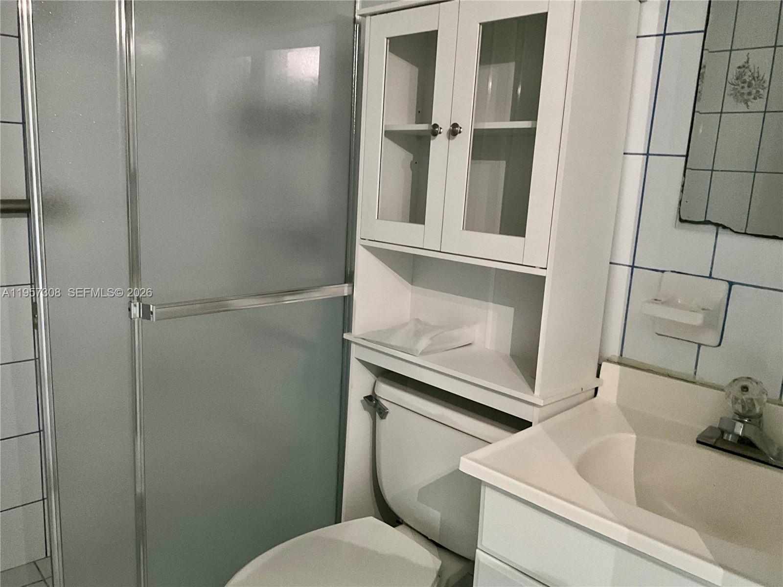 1910 West 56th Street, Unit 3302 Hialeah, FL 33012 - Photo 17 of 19 a bathroom with a sink and toilet