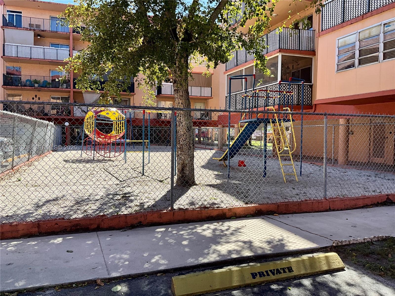 1910 West 56th Street, Unit 3302 Hialeah, FL 33012 - Photo 19 of 19 a view of a park with iron fence