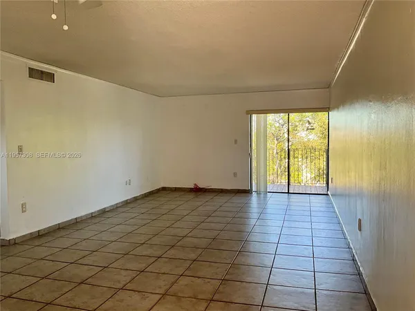 a view of an empty room and window