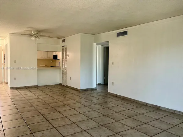 a kitchen with stainless steel appliances a sink a stove a microwave and cabinets