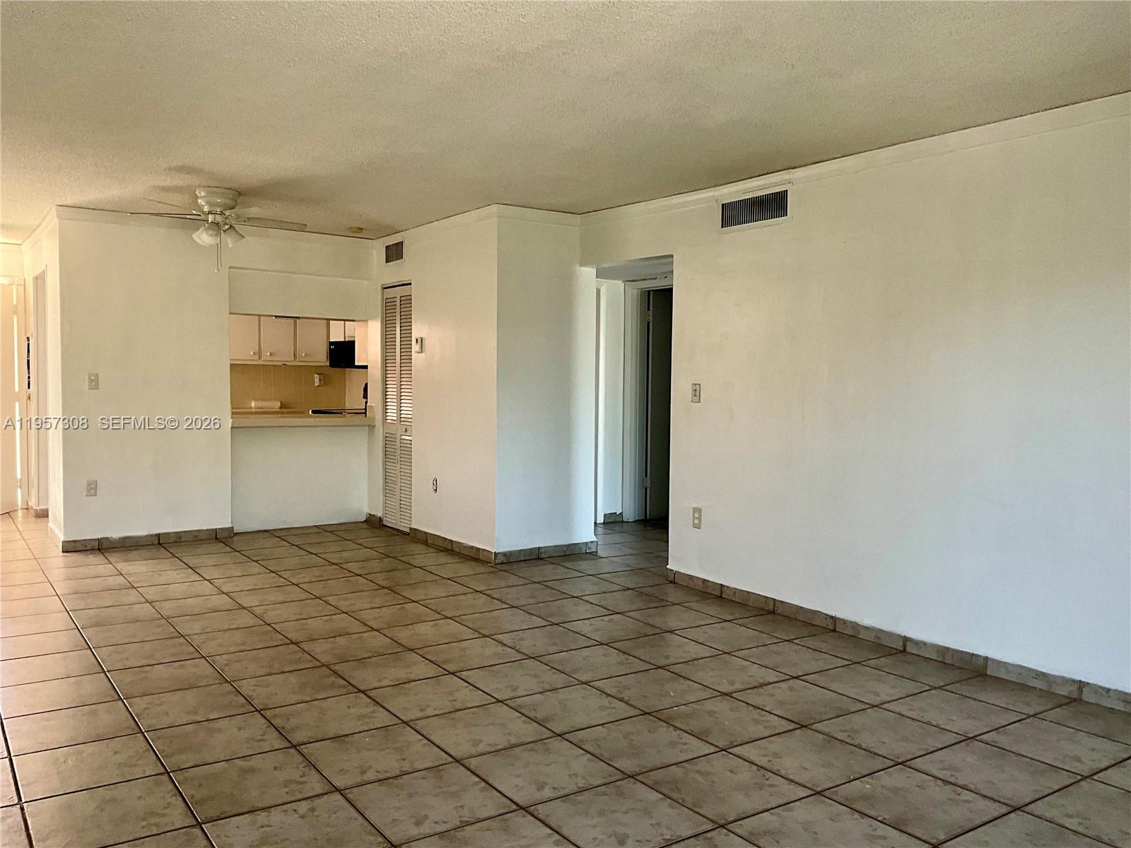 1910 West 56th Street, Unit 3302 Hialeah, FL 33012 - Photo 6 of 19 a view of a refrigerator in kitchen and a white kitchen