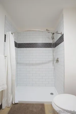 a bathroom with a bathtub and a shower