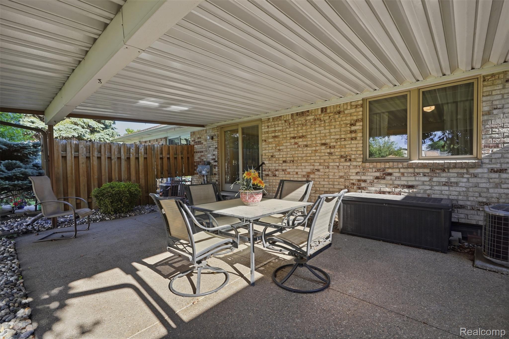 18160 Raleigh Square Drive Southgate, MI 48195 - Photo 27 of 31 Covered patio area featuring a concrete surface and a vertical plank fence