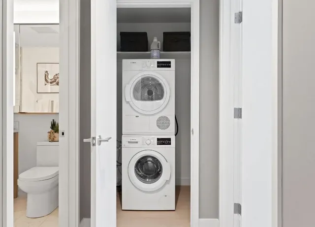 a view of a hallway with washer and dryer