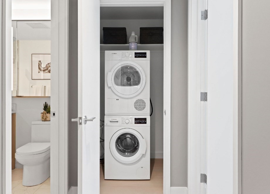 390 Harrison Avenue, Unit 416 Boston, MA 02118 - Photo 6 of 12 a view of a hallway with washer and dryer