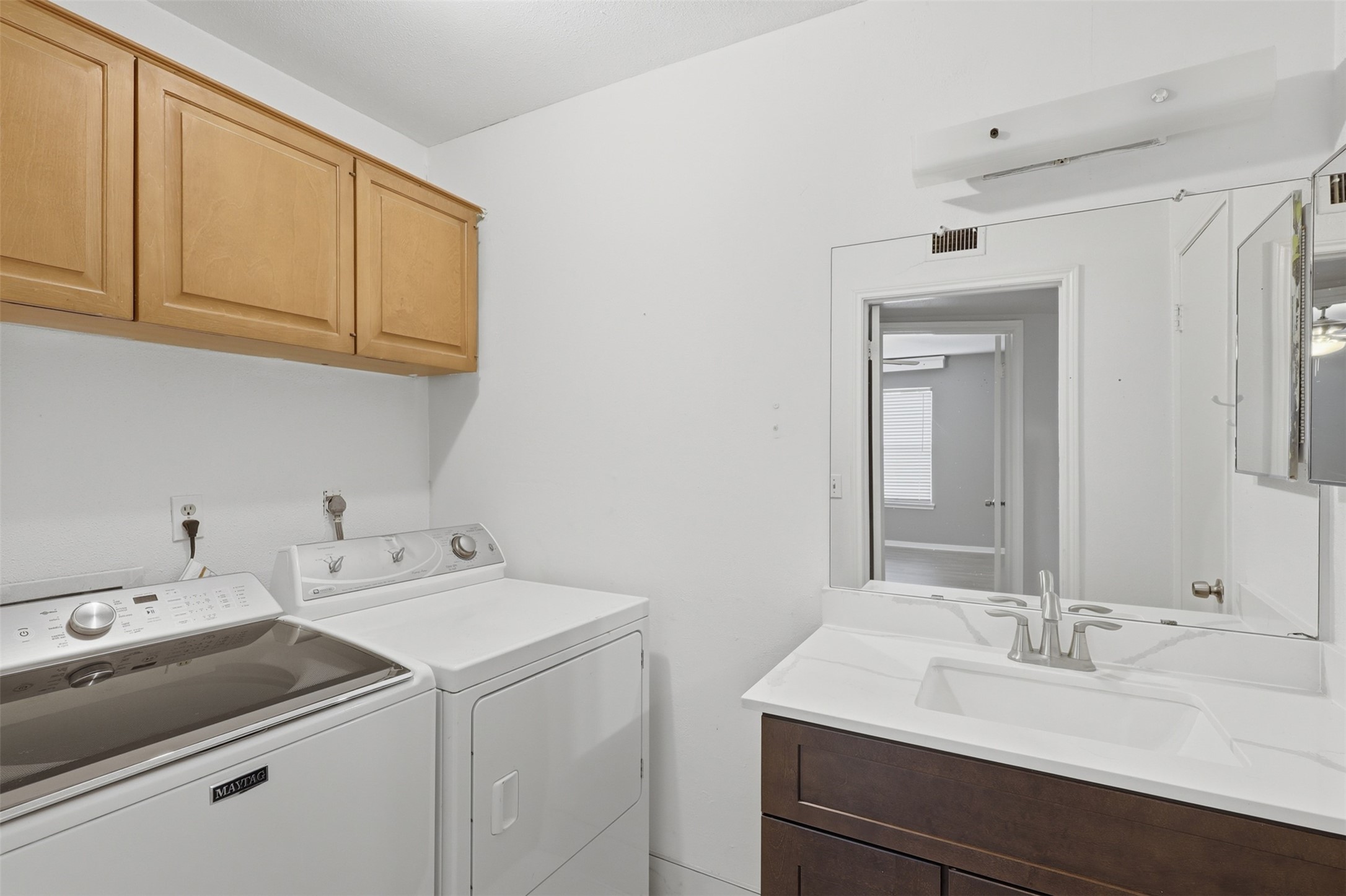 811 Threadneedle Street, Unit 287 Houston, TX 77079 - Photo 10 of 16 Utility room with washer and dryer included plus additional storage.