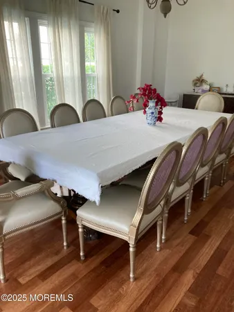 a view of a dining room with furniture and window