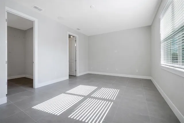 an empty room with windows