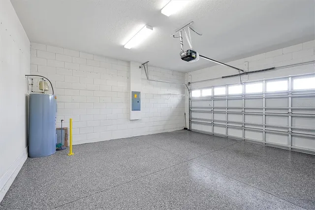 a view of a house with a big yard and large trees